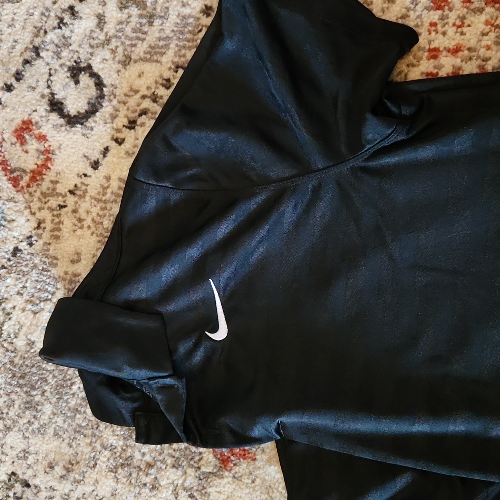Nike Dri-Fit polo. Black with black stripes. Size medium.